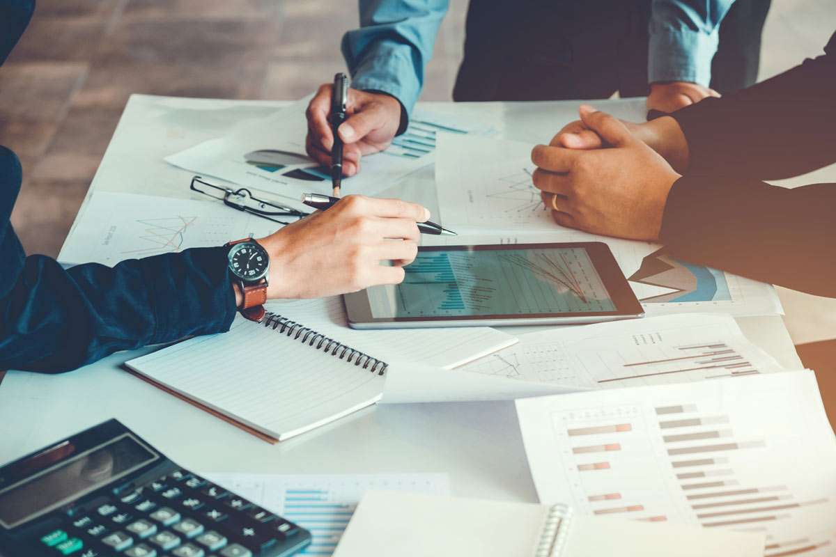 people work with business graphs and charts on human resources crisis management